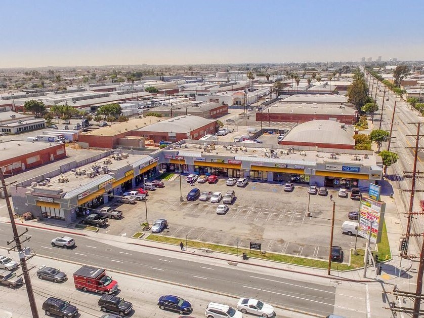 an aerial view of a gas station and parking lot