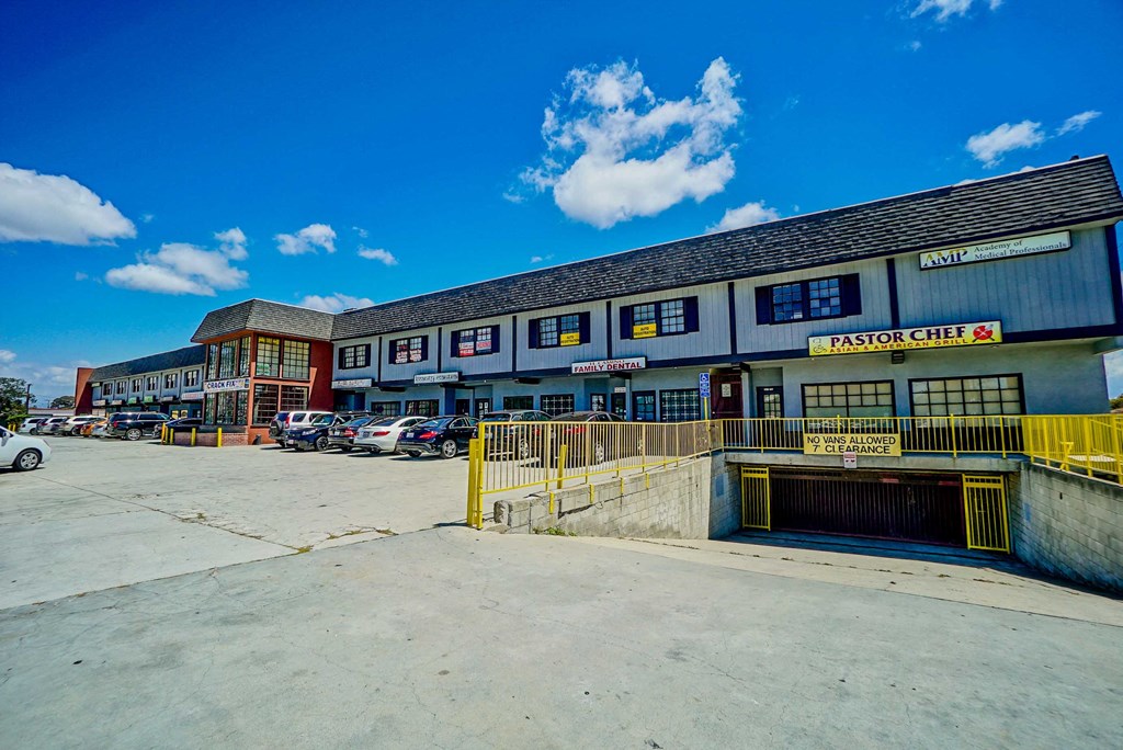 an empty parking lot in front of a building