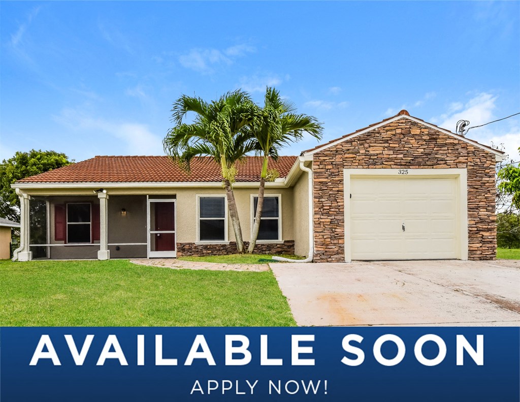 a house with a palm tree in front of it