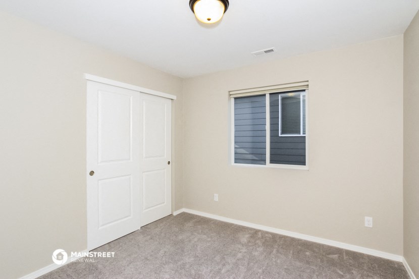the upstairs bedroom has a closet and a window