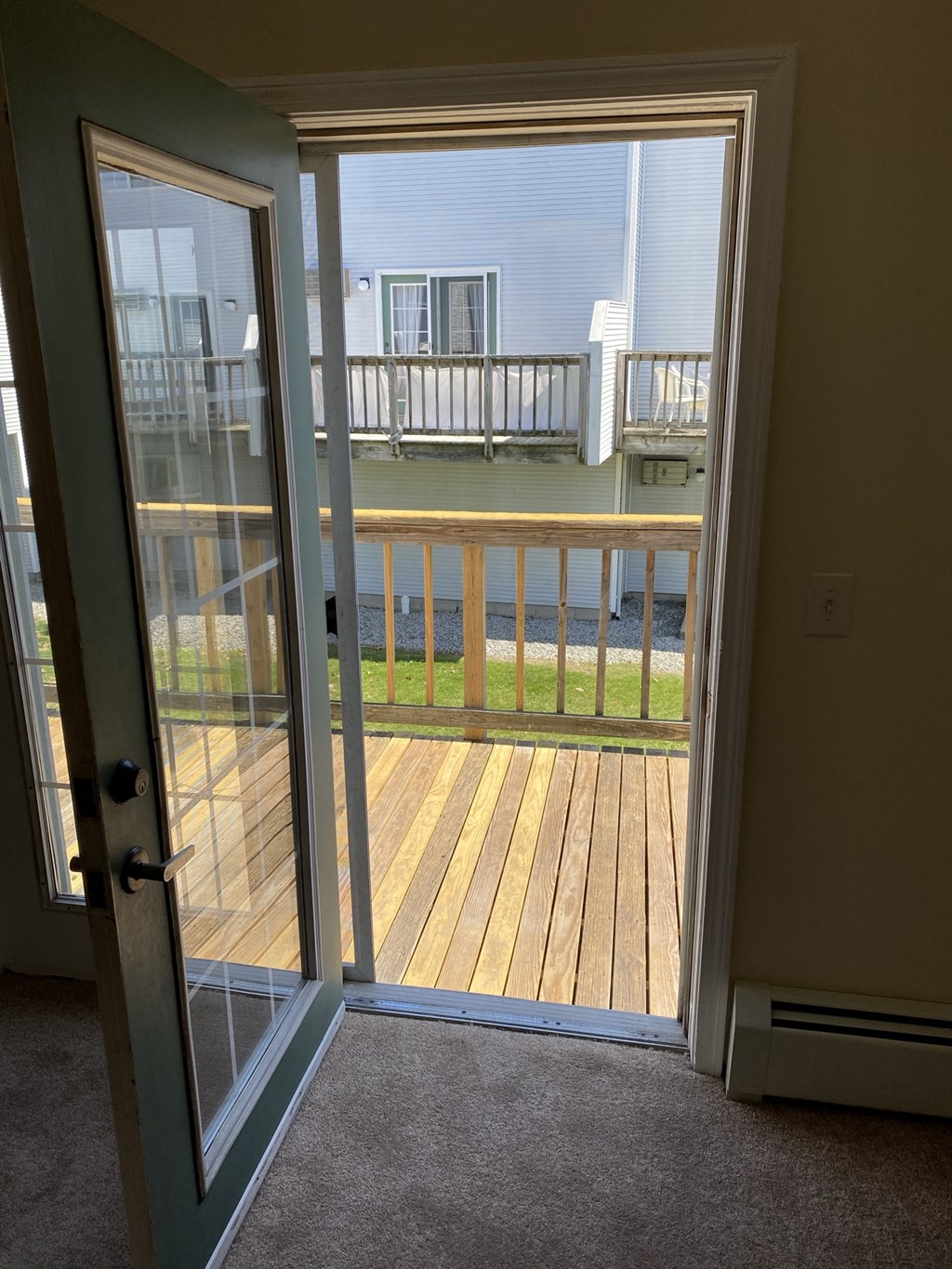 the view of the deck from the backdoor of the house