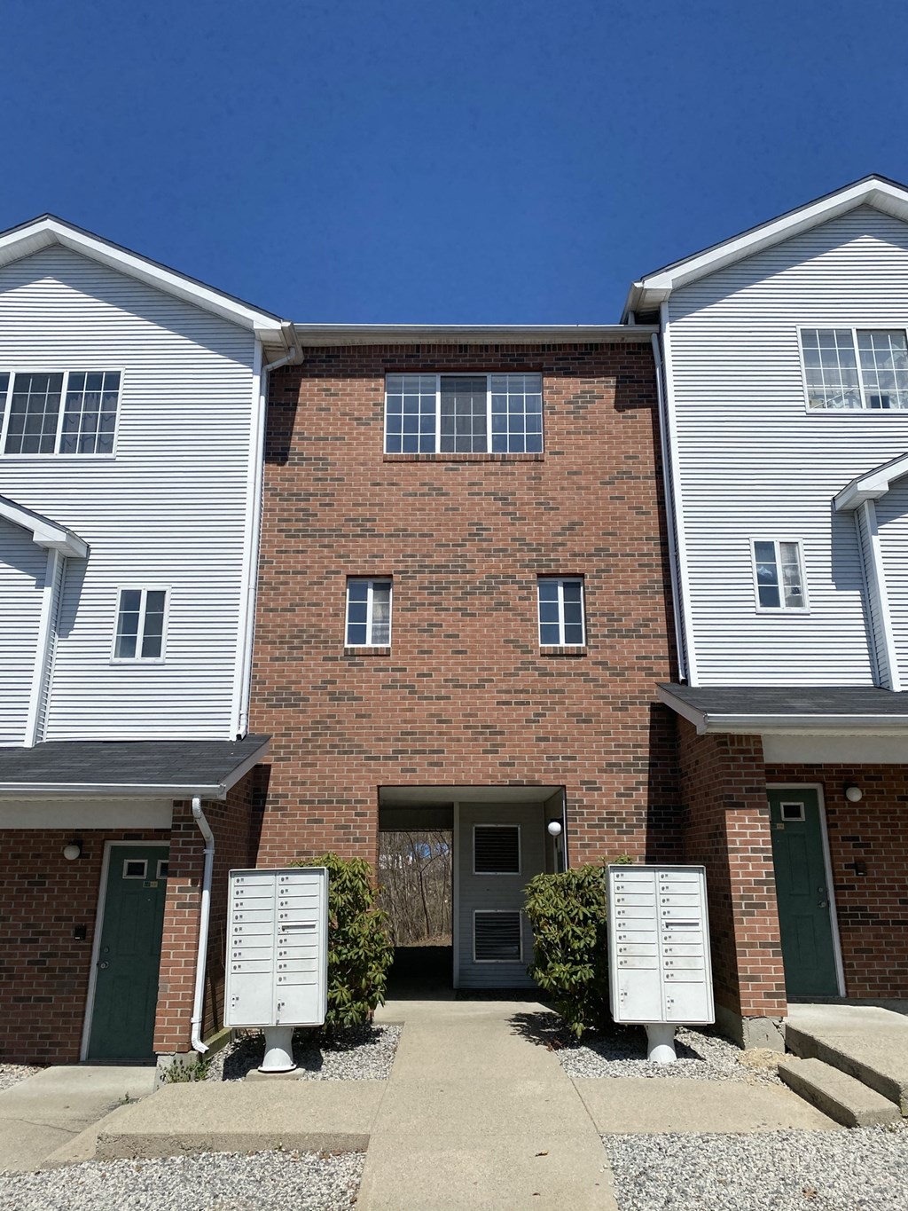 a brick building with a driveway in front of it