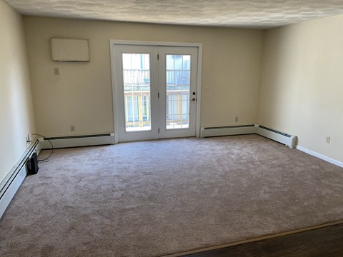 the living room is empty and ready for us to move in