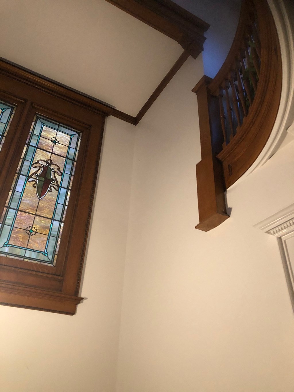 a stained glass window on the ceiling of a church
