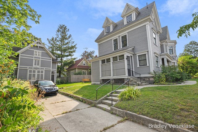 a with a car parked in front of it