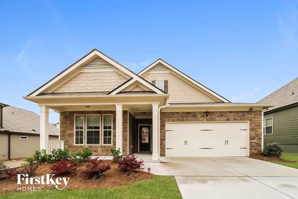 a house with a white garage door in front of it