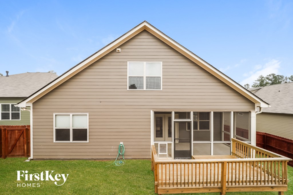the exterior of a house with a deck and a porch