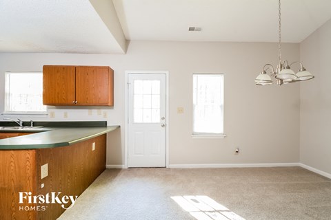 a kitchen with a counter top and a white door