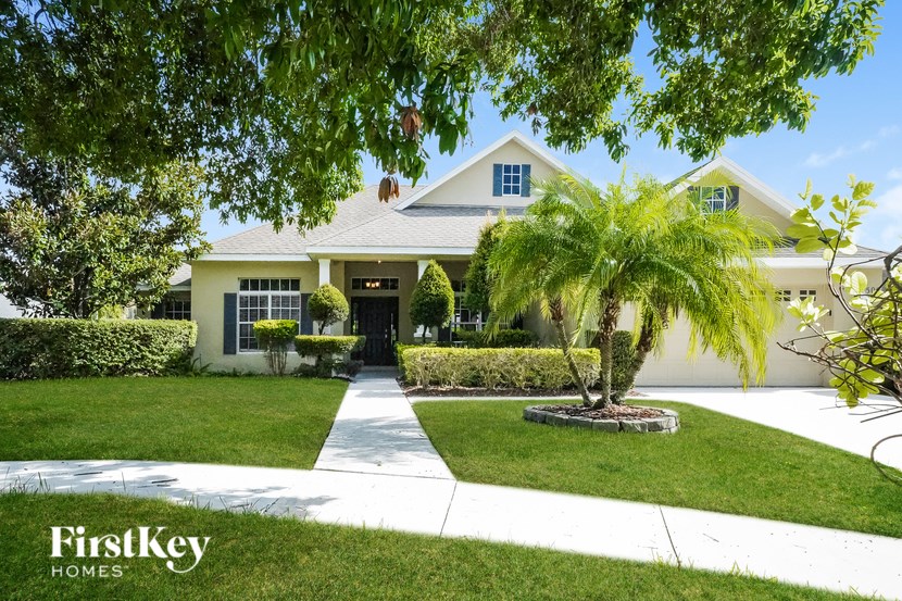 A house with a tree in front of it.