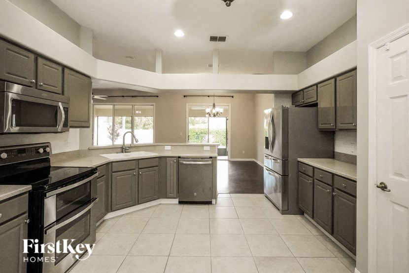 A kitchen with a FirstKey Homes logo.