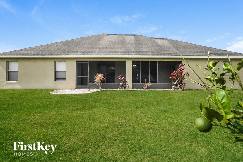 A house with a lawn in front of it.