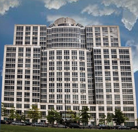 a tall building with a blue sky in the background