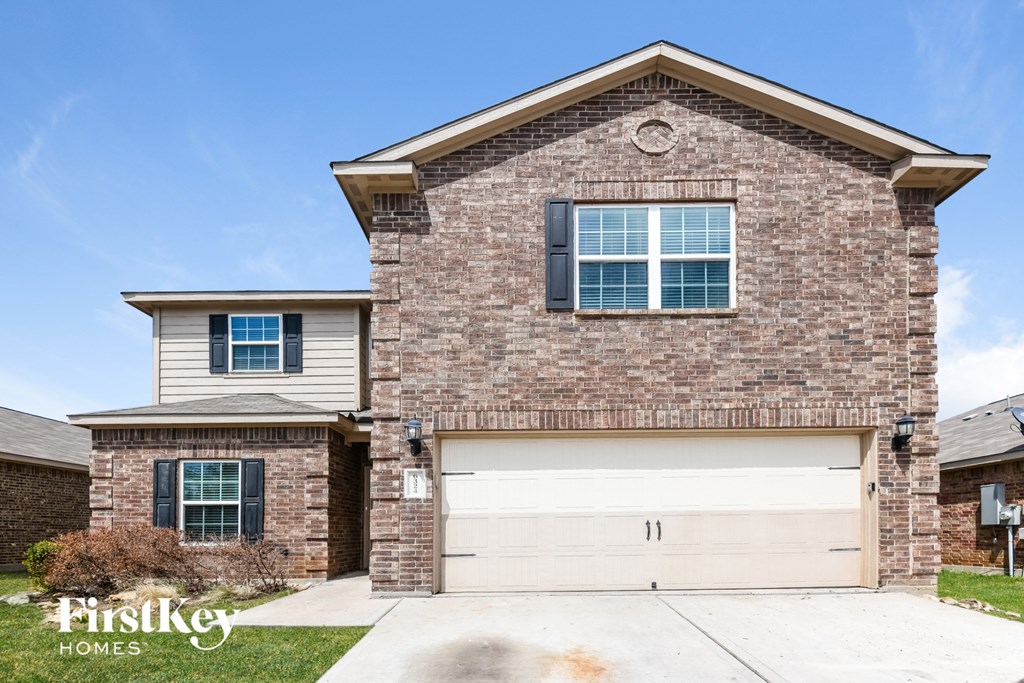 a house with a white garage door in front of it