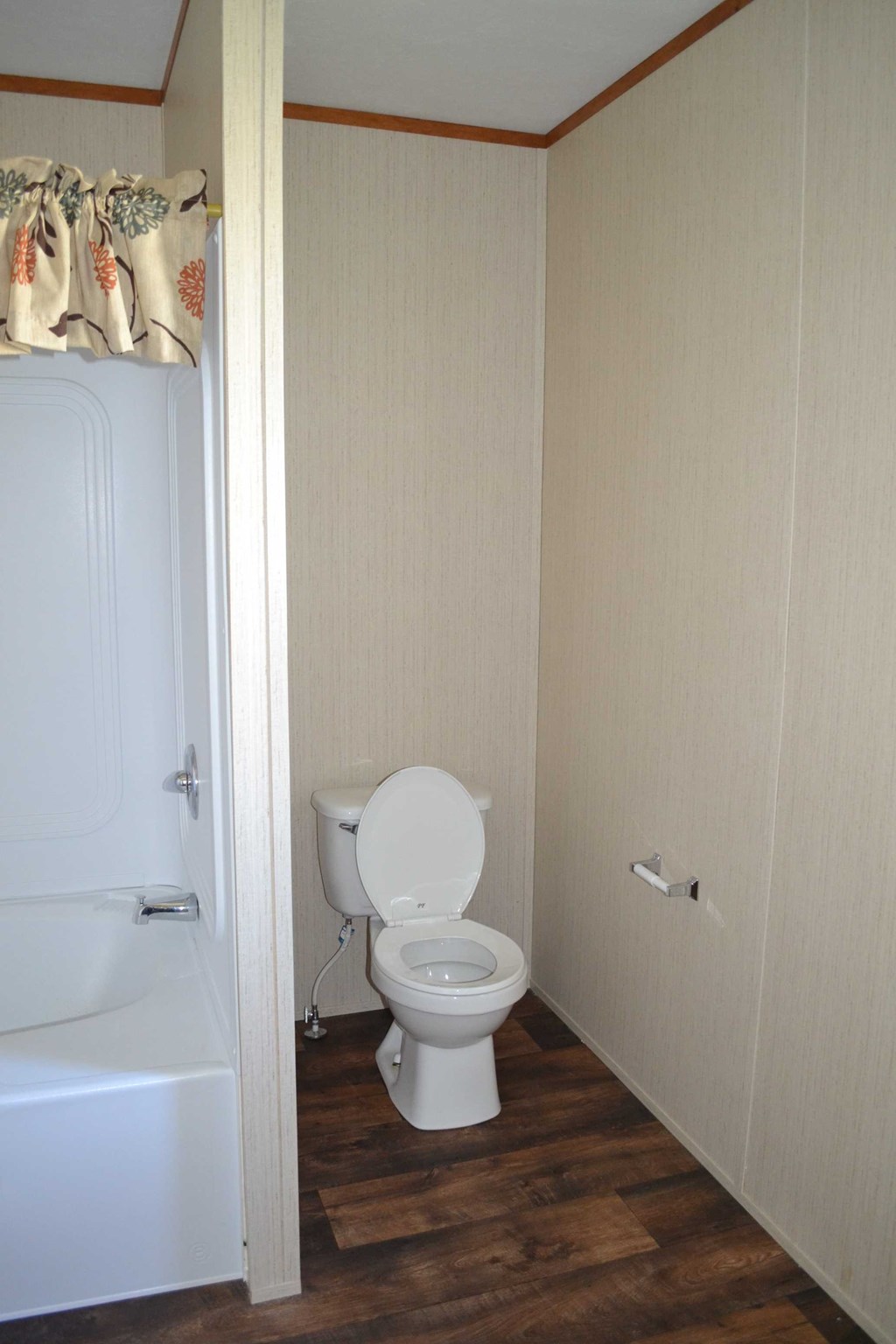 a small bathroom with a toilet and a bath tub