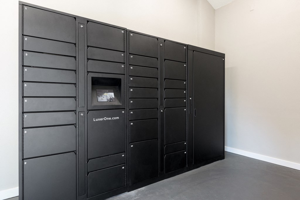 a group of black lockers in a room