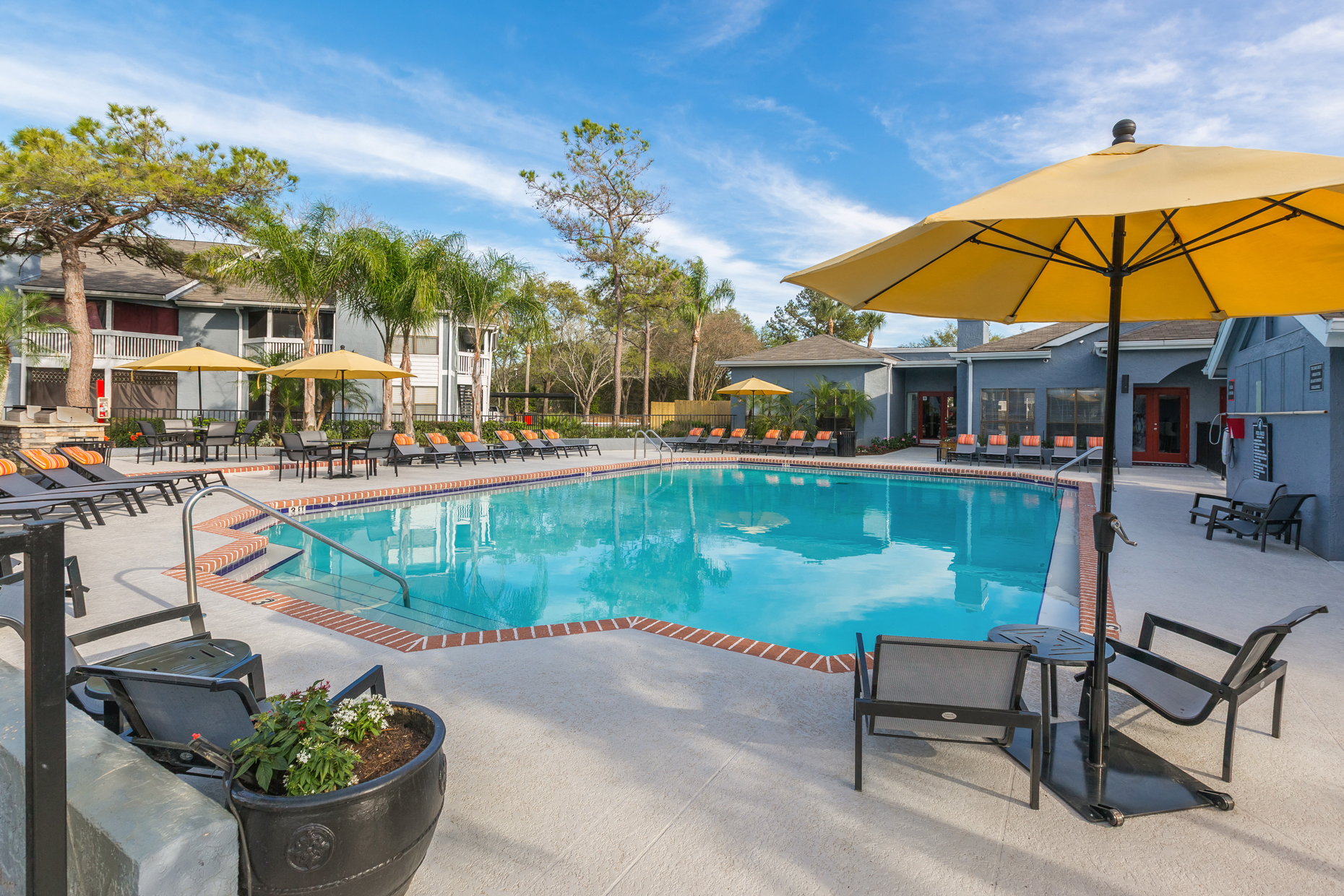 Poolside Seating at Northgreen at Carrollwood Apartments in Tampa, FL