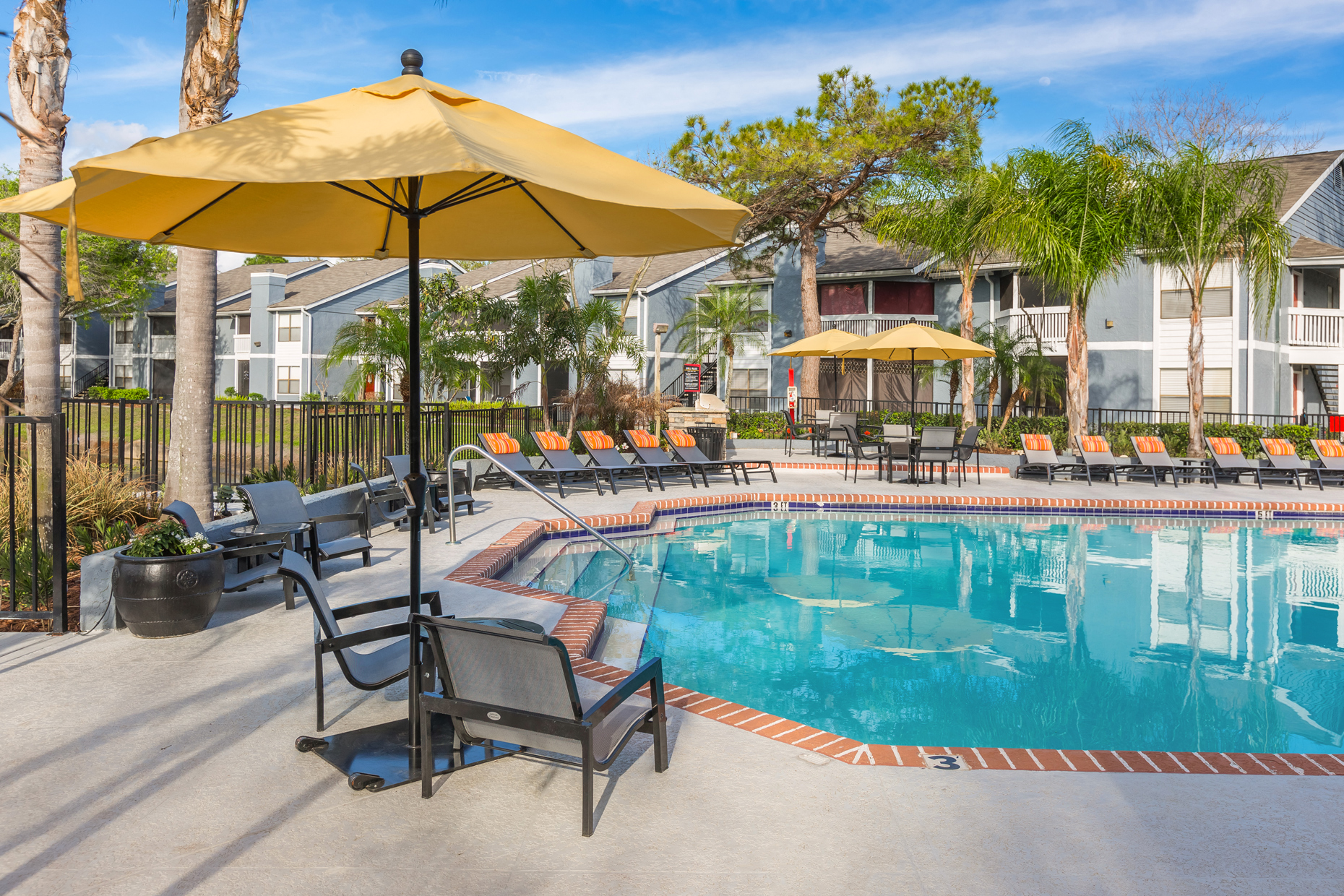 Poolside Seating at Northgreen at Carrollwood Apartments in Tampa, FL