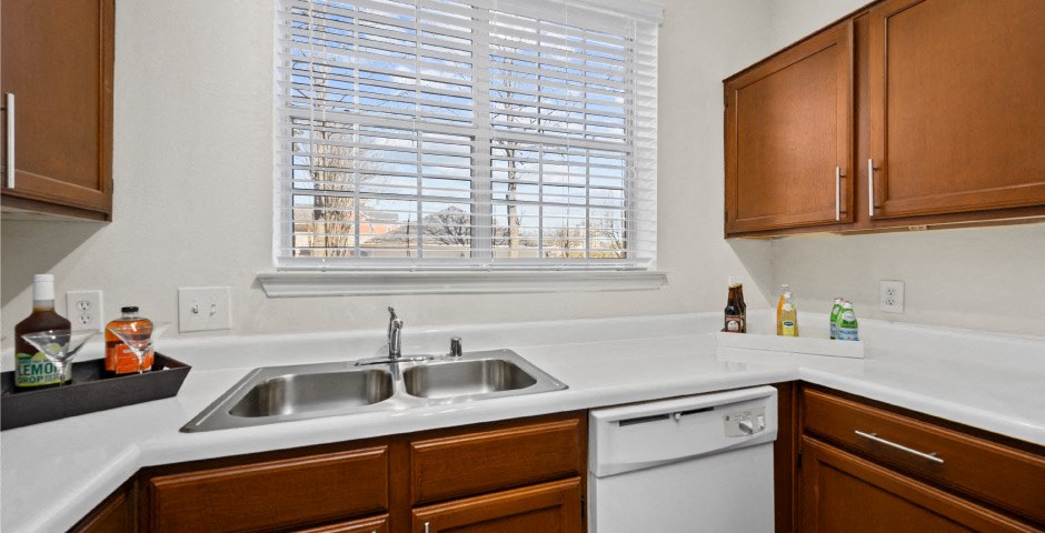 Luxury apartments with spacious kitchens, custom home cabinets, and side-by-side refrigerators at The Lanesborough Apartments in Houston.