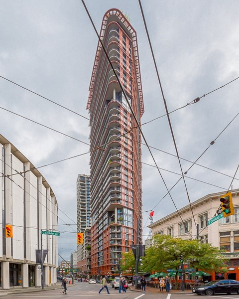 a view of a tall building on a city street