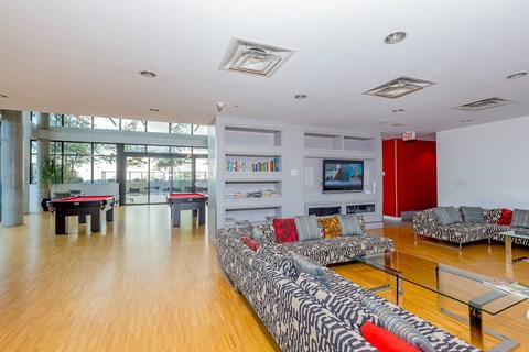 a living room with a couch and a table and a television