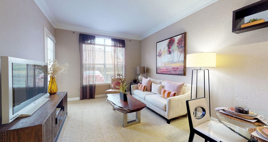 Luxury apartments with spacious living room and 10-foot ceilings at Tuscany Court Apartments in Houston.