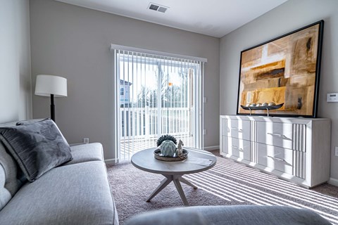 a living room with a couch and a table