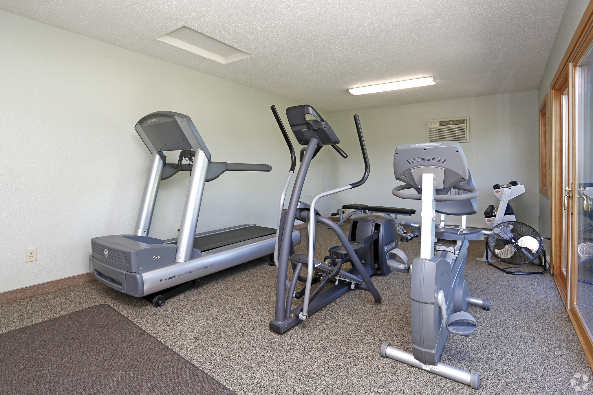 Fitness room with treadmill, elliptical and bike