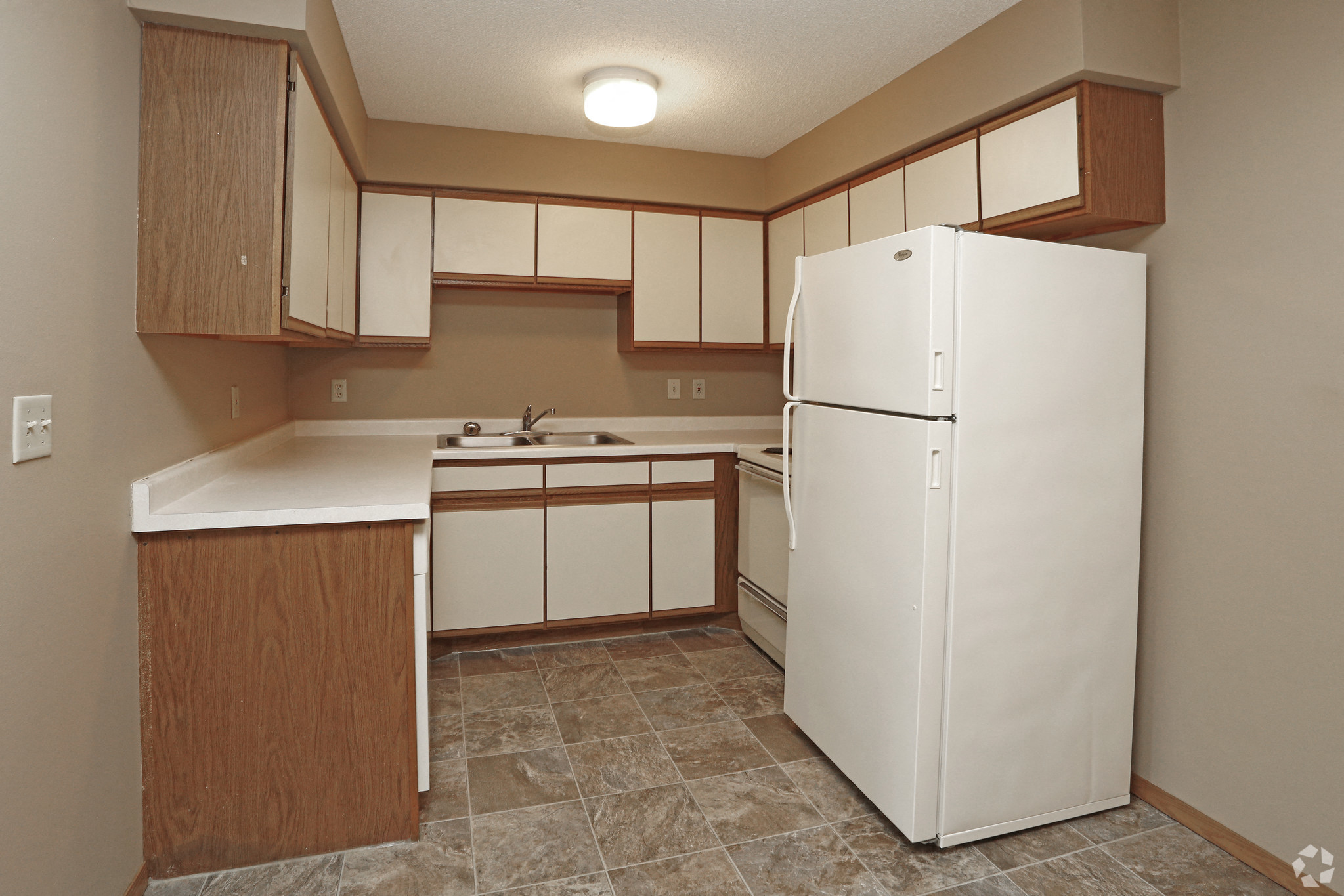 Kitchen with white and brown cabinets
