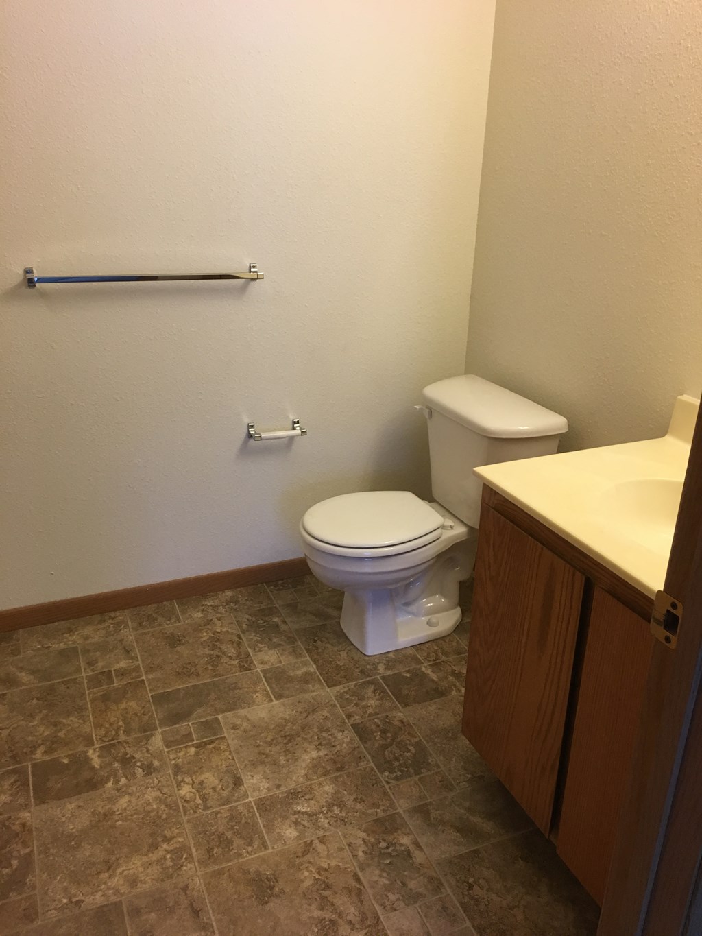 a bathroom with a toilet and a sink