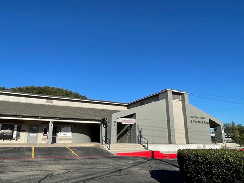 The image shows a building with a sign that reads "Stoney Plain".