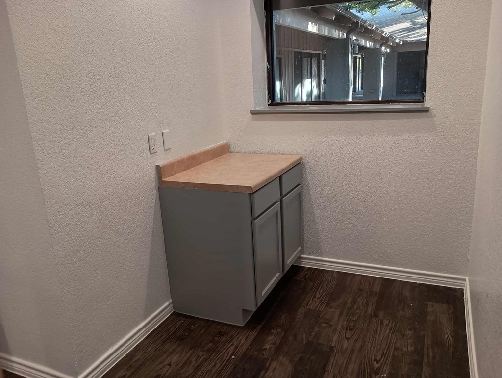 a small bathroom with a sink and a window