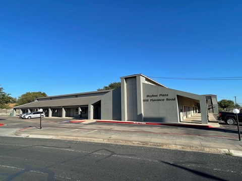 A building with the words "Skyline Plaza" on the front.
