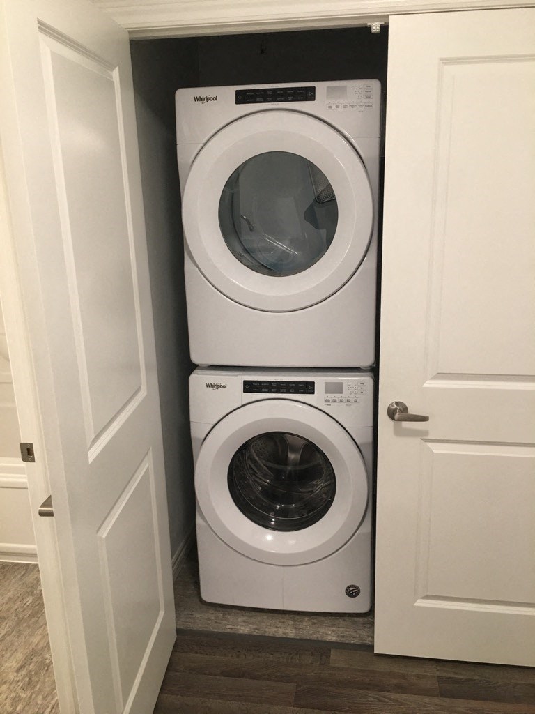 a washing machine and a dryer in a closet