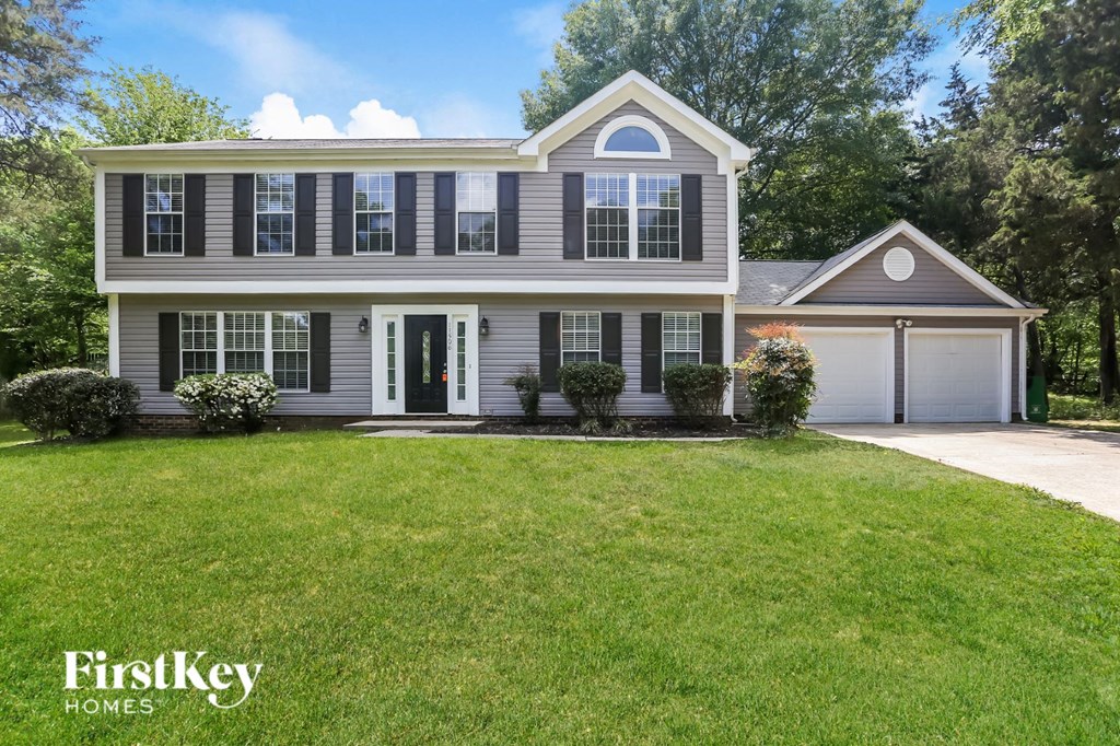 a home with a lawn in front of it