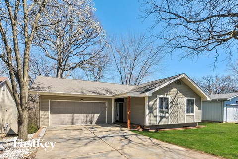 A house with a garage is for sale.