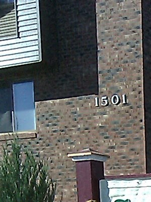 a sign for greenway north in front of a building