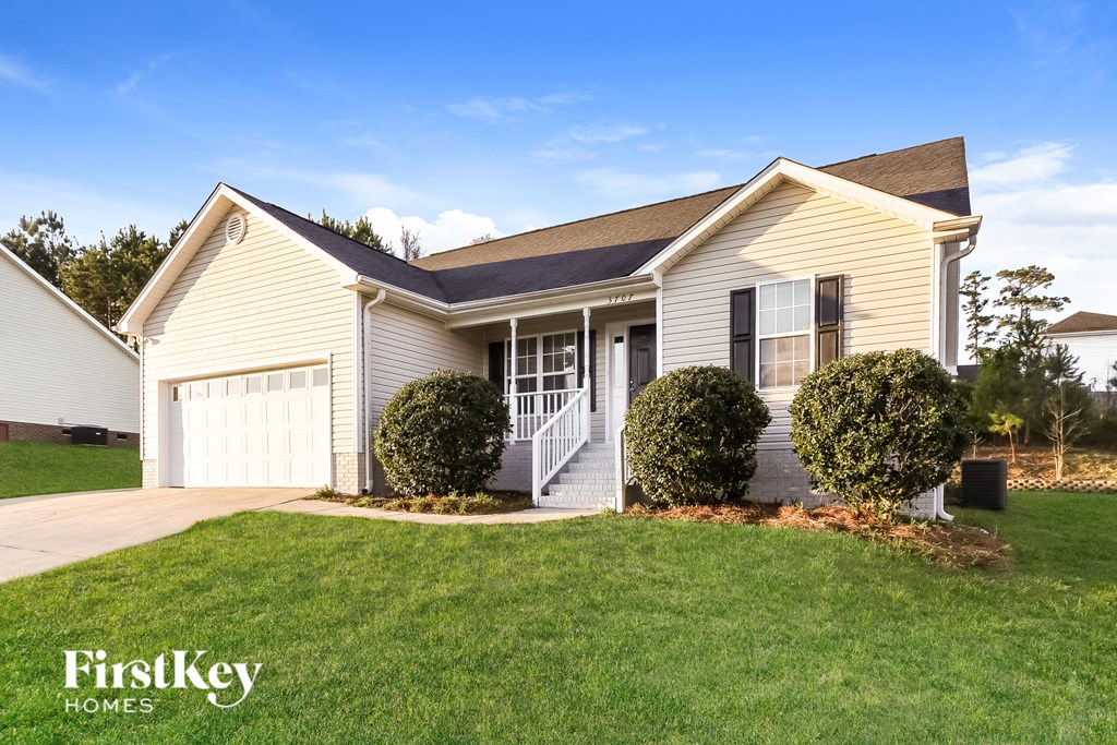 A house with a garage is for sale by FirstKey Homes.
