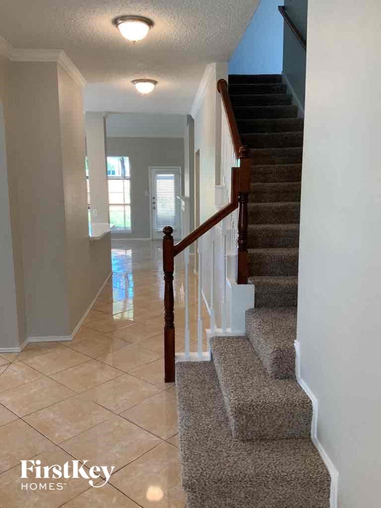 a view of the stairs from the landing of a house
