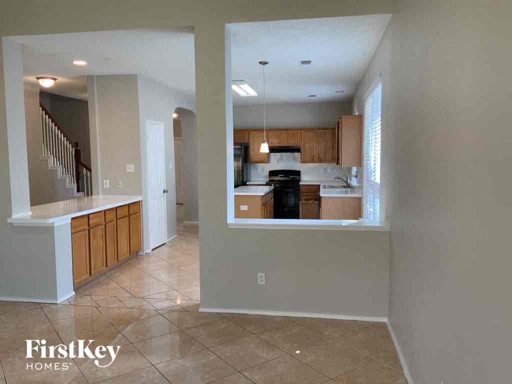 a view of a kitchen from the living room