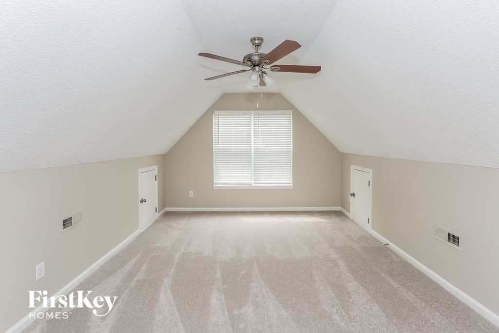 the loft is spacious and has a ceiling fan