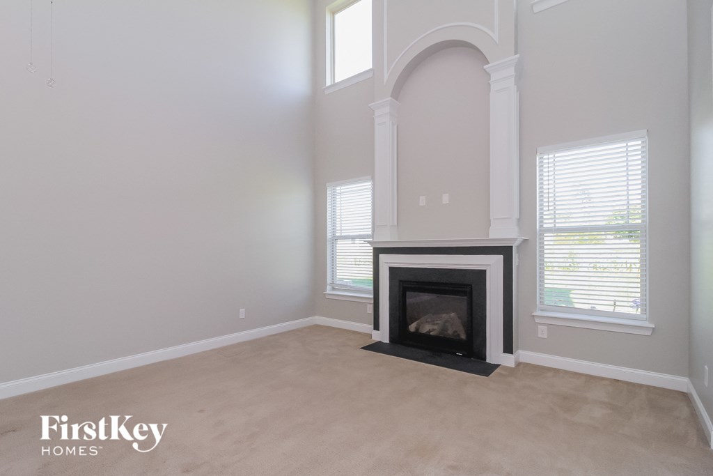 the living room of a home with a fireplace