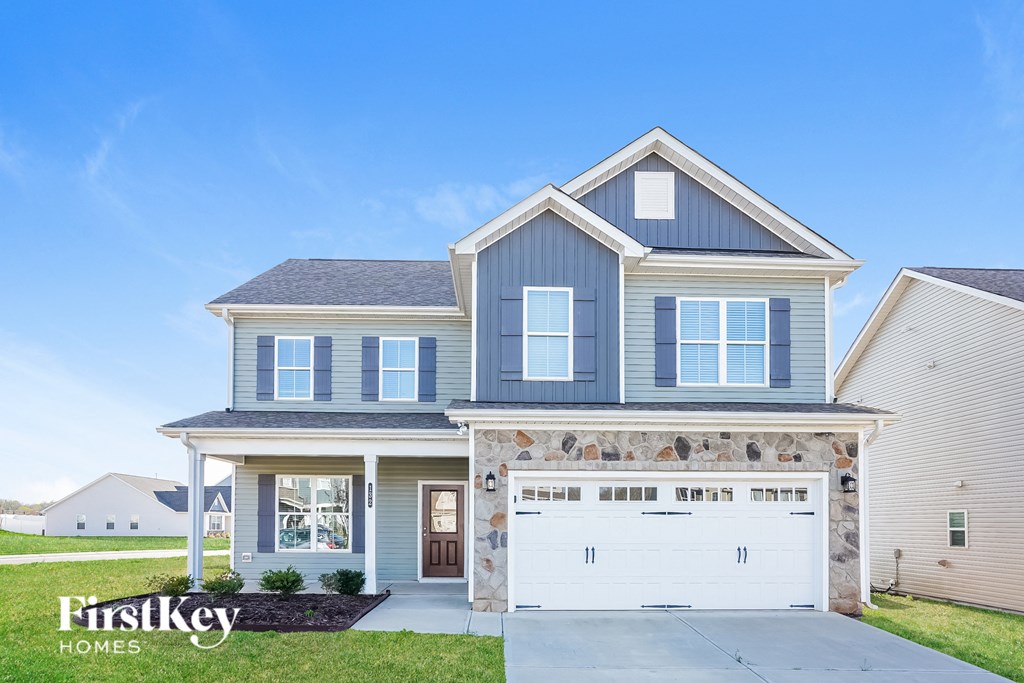 a blue house with a white garage door