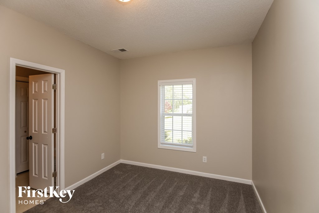 A room with a door and a window.