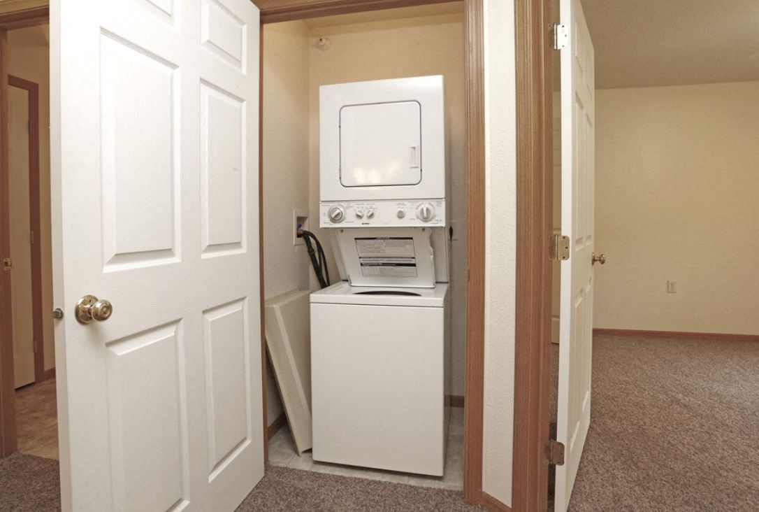 a washer and dryer in a room with a door