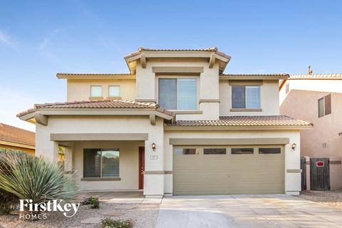 a house with a garage door in front of it