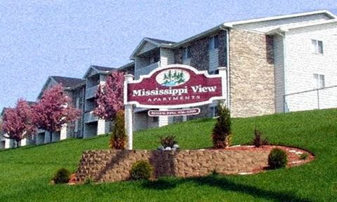 a view of the view apartments sign in front of the building