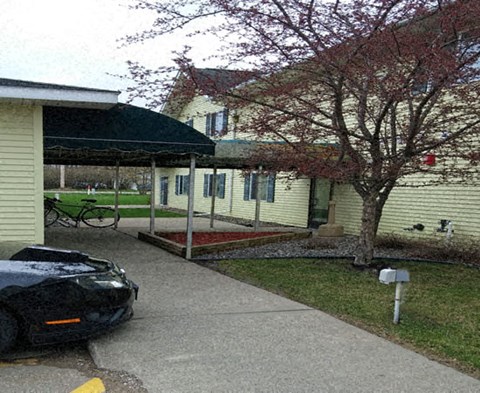 a house with a car parked in the driveway