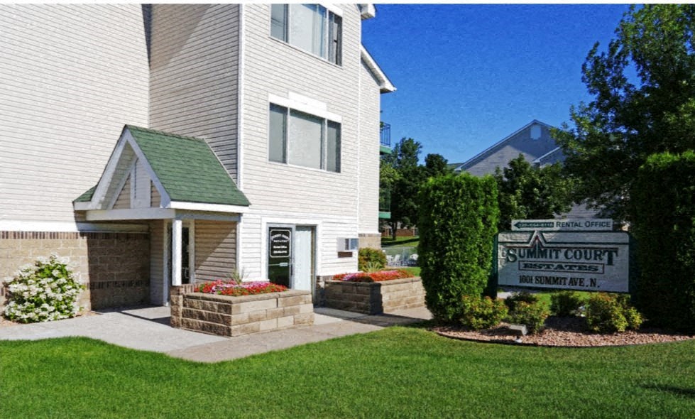 a white building with a sign in front of it
