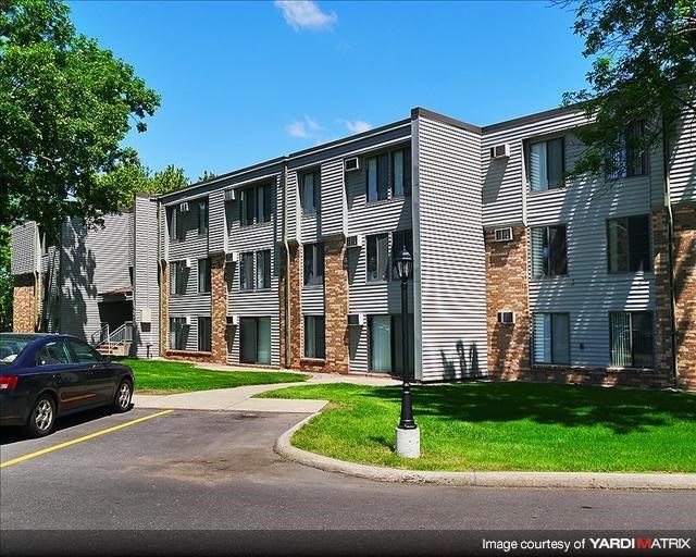 a car parked in front of an apartment building