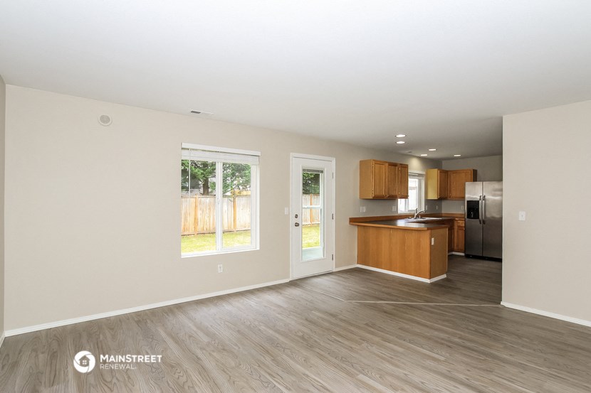 the living room and kitchen of an apartment